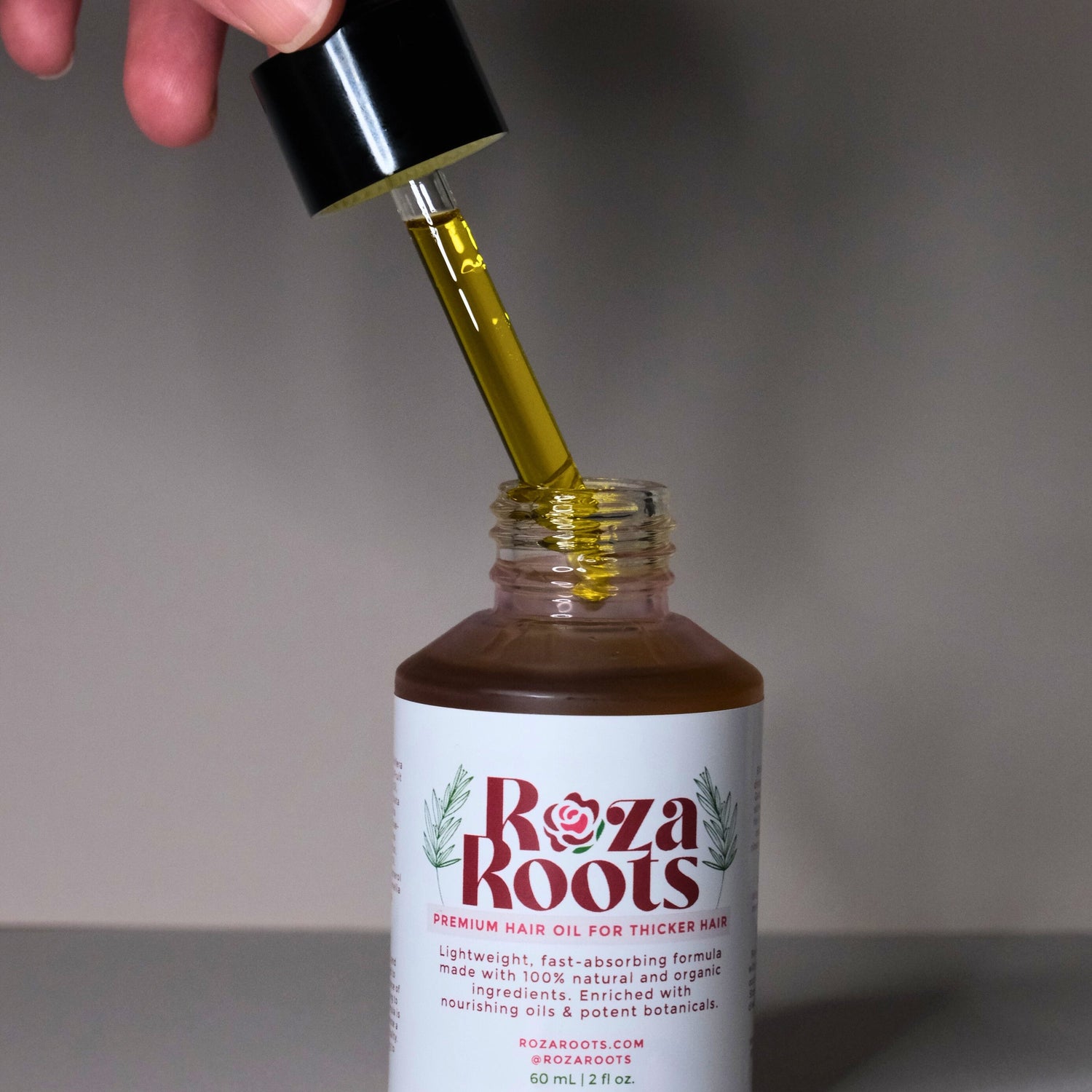 Roza Roots hair oil bundle - three bottles for nourishing scalp, promoting hair growth, and reducing hair fall